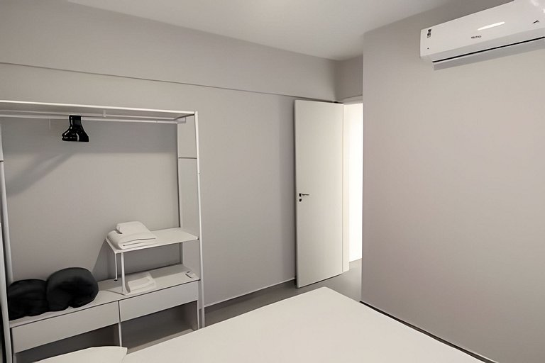 2 quartos com ar e garagem